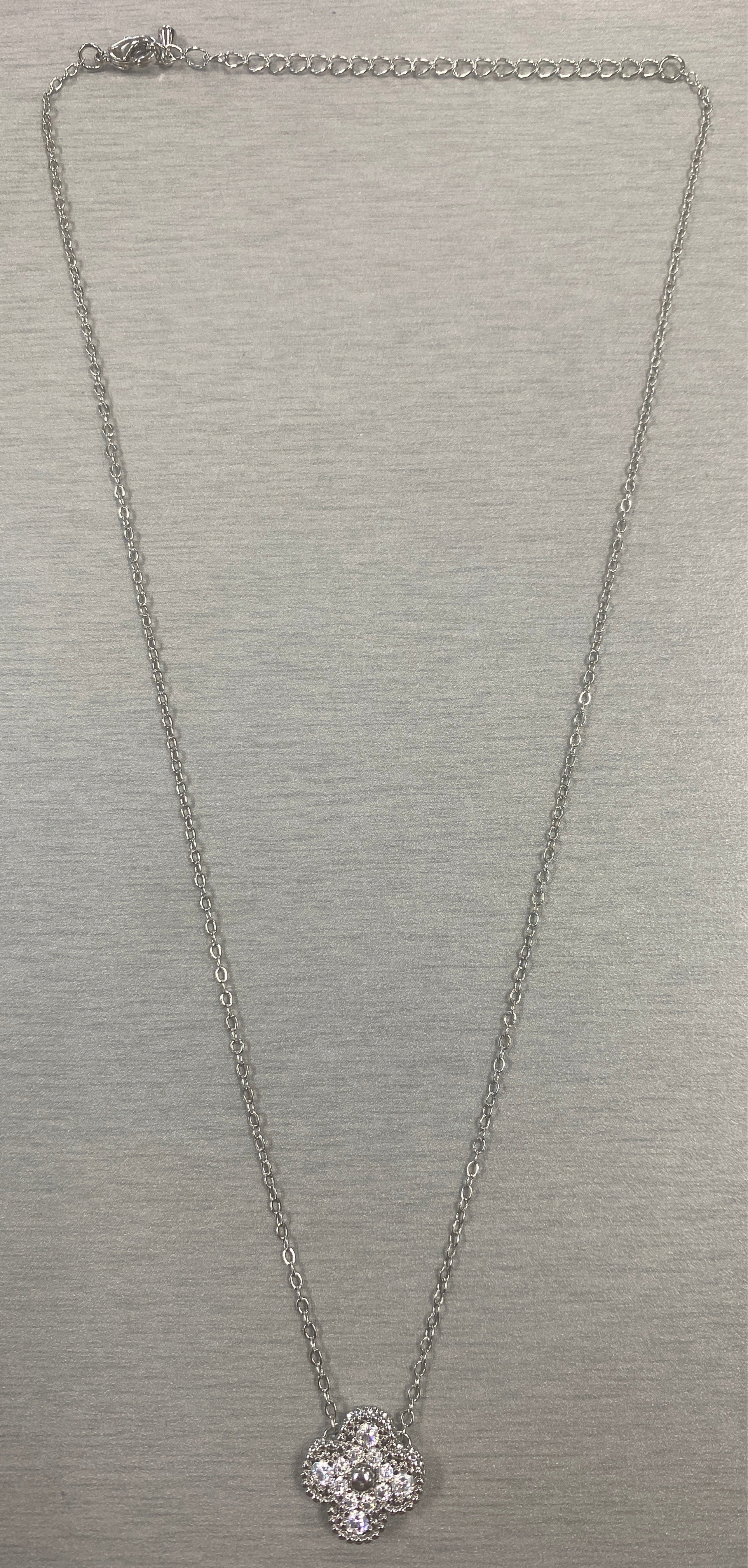 Elegant clover motif charm necklace