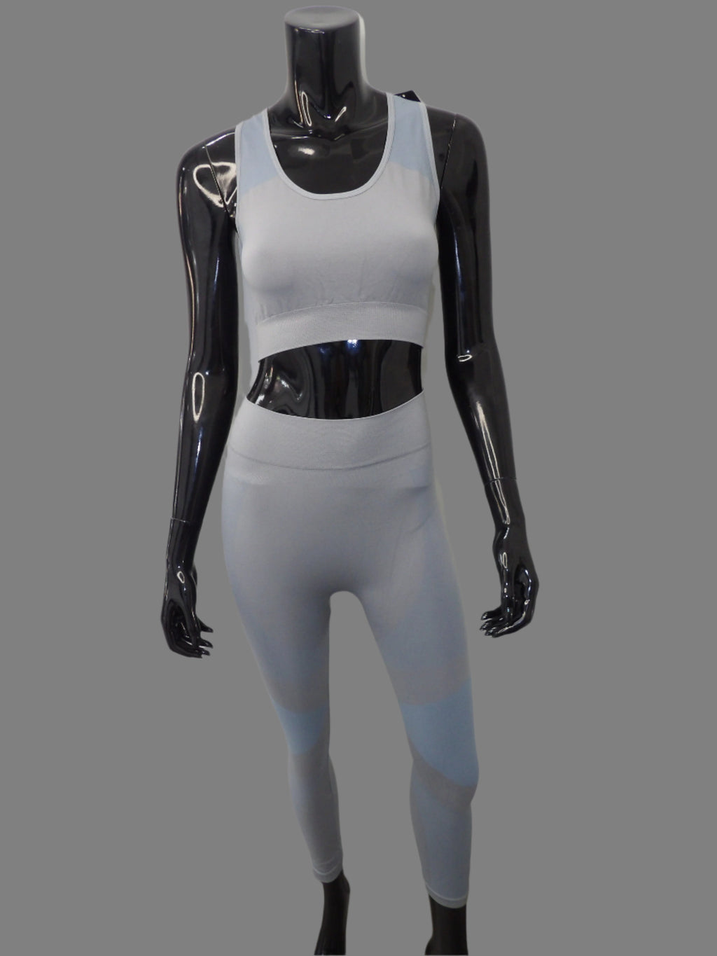 2-piece activewear set featuring high-waisted seamless leggings and a stretchy sports bra, designed for comfort and style during workouts or casual wear.