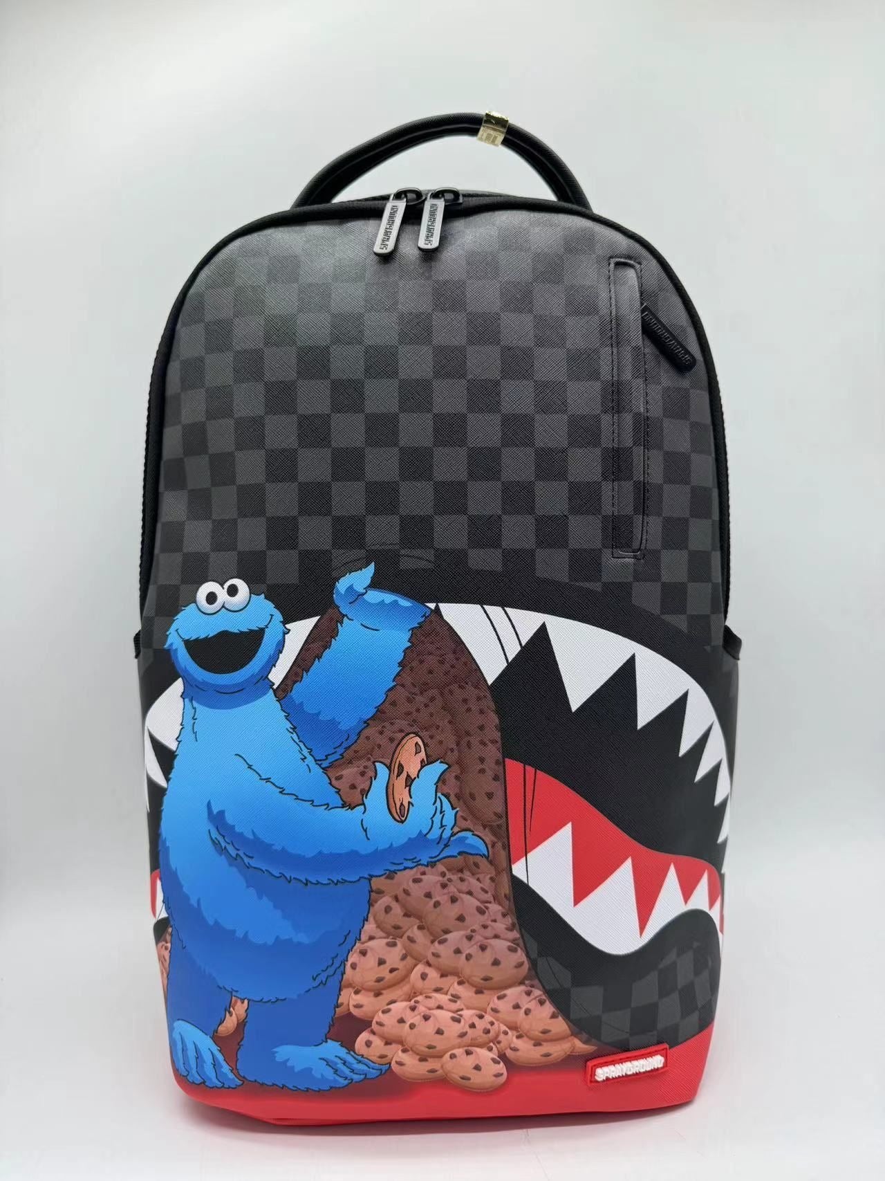 SPRAYGROUND - Sesame Street Cookie Monster Sneaking A Bite DLXSV Backpack