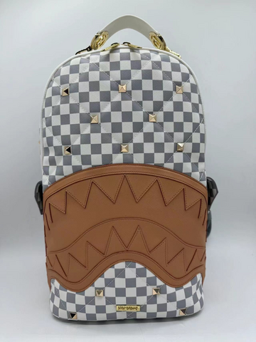 Backpack with checkered pattern and brown accents on a white background