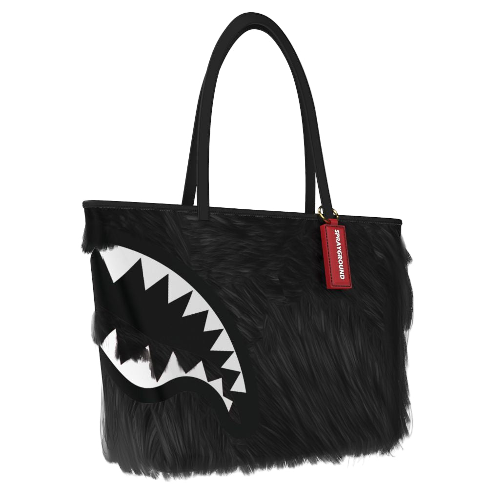 Black furry tote bag with a shark mouth design and a red tag on a white background