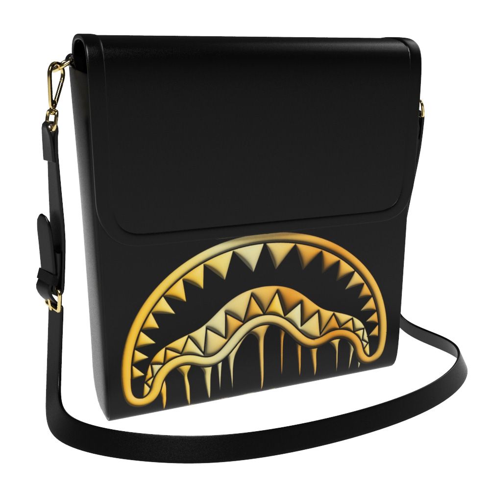 Black crossbody bag with a gold shark mouth design on a white background