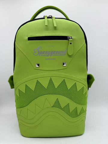 Green backpack with shark mouth design and 'Sprayground' branding on a white background