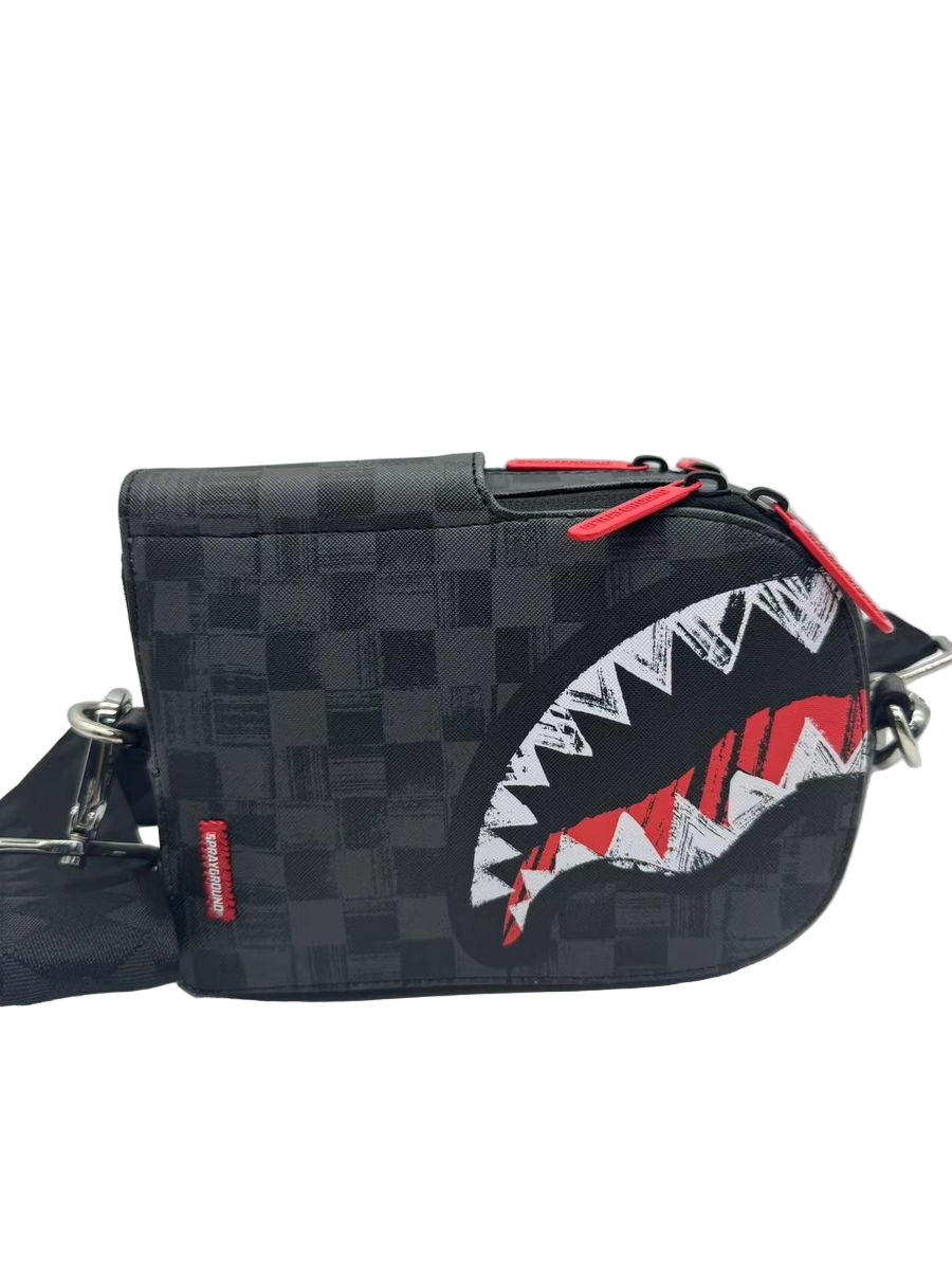 Black checkered crossbody bag with shark mouth design on a light gray background