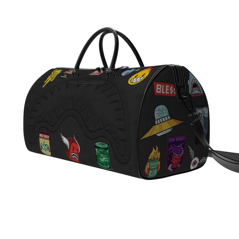 Black duffel bag with colorful patches on a white background