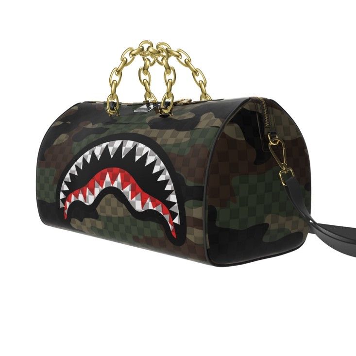 Camouflage handbag with a shark mouth design and gold chain handle on a white background