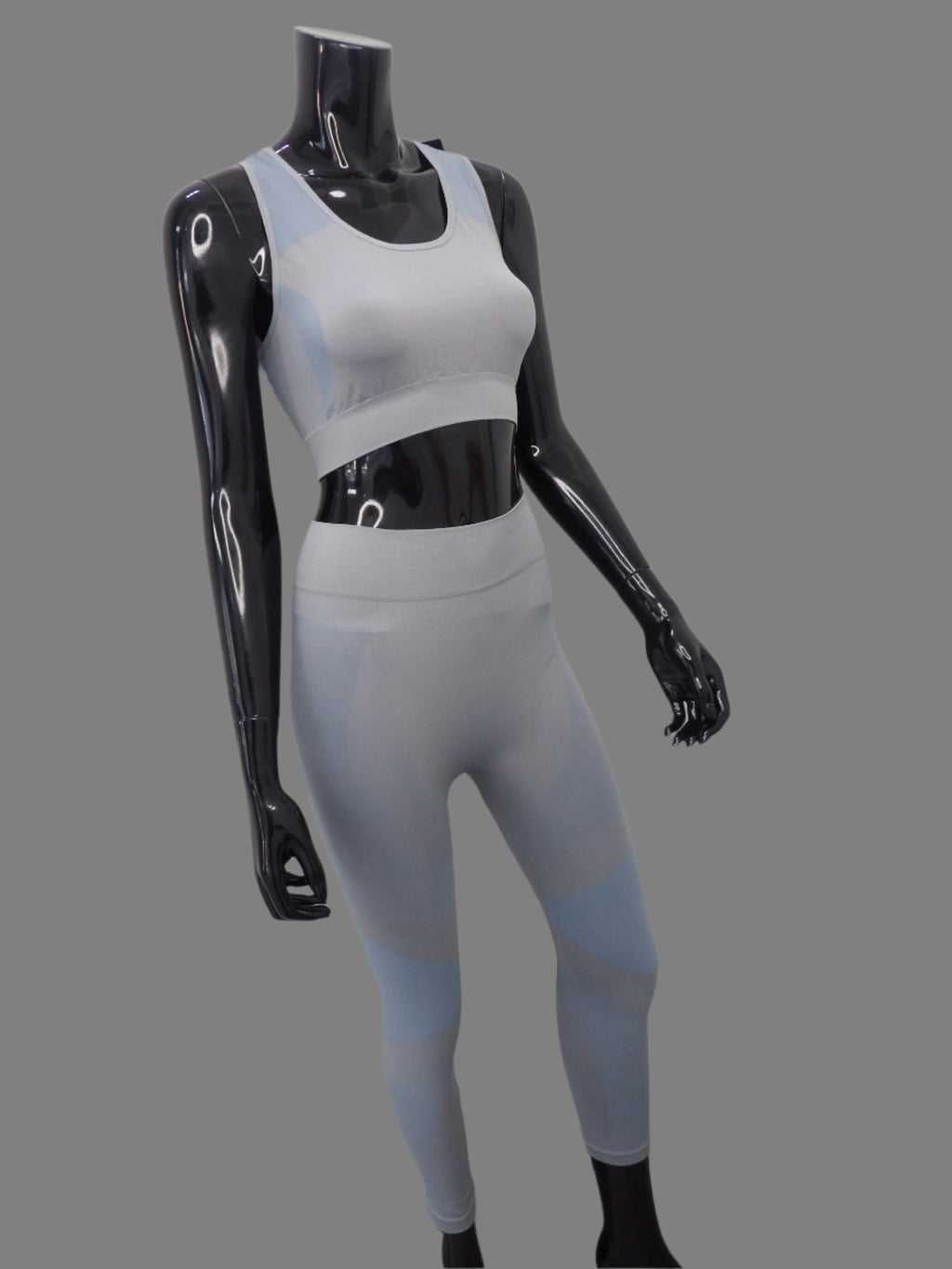 2-piece activewear set featuring high-waisted seamless leggings and a stretchy sports bra, designed for comfort and style during workouts or casual wear.